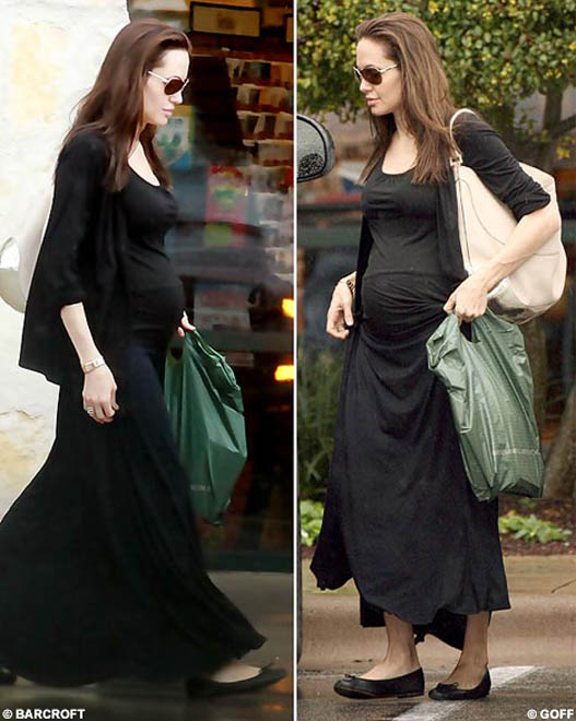 Heavily pregnant Angelina Jolie takes to the skies