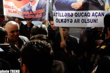 "Позор для страны, открывающей объятия убийцам" (фотосессия)