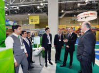 Azerbaijani president observes two exhibitions in Baku (PHOTO)