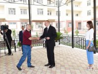 Президент Азербайджана и его супруга приняли участие в церемонии передачи квартир и автомобилей инвалидам войн и семьям шехидов (ФОТО)