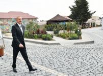 Azerbaijani president, first lady view landscaping work carried out in Balakhani settlement (PHOTO)
