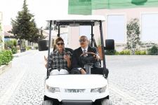 Azerbaijani president, first lady view landscaping work carried out in Balakhani settlement (PHOTO)