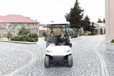 Azerbaijani president, first lady view landscaping work carried out in Balakhani settlement (PHOTO)