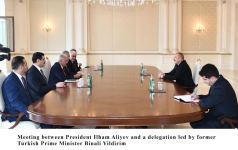 President Ilham Aliyev receives delegation led by former Turkish PM Binali Yildirim (PHOTO)