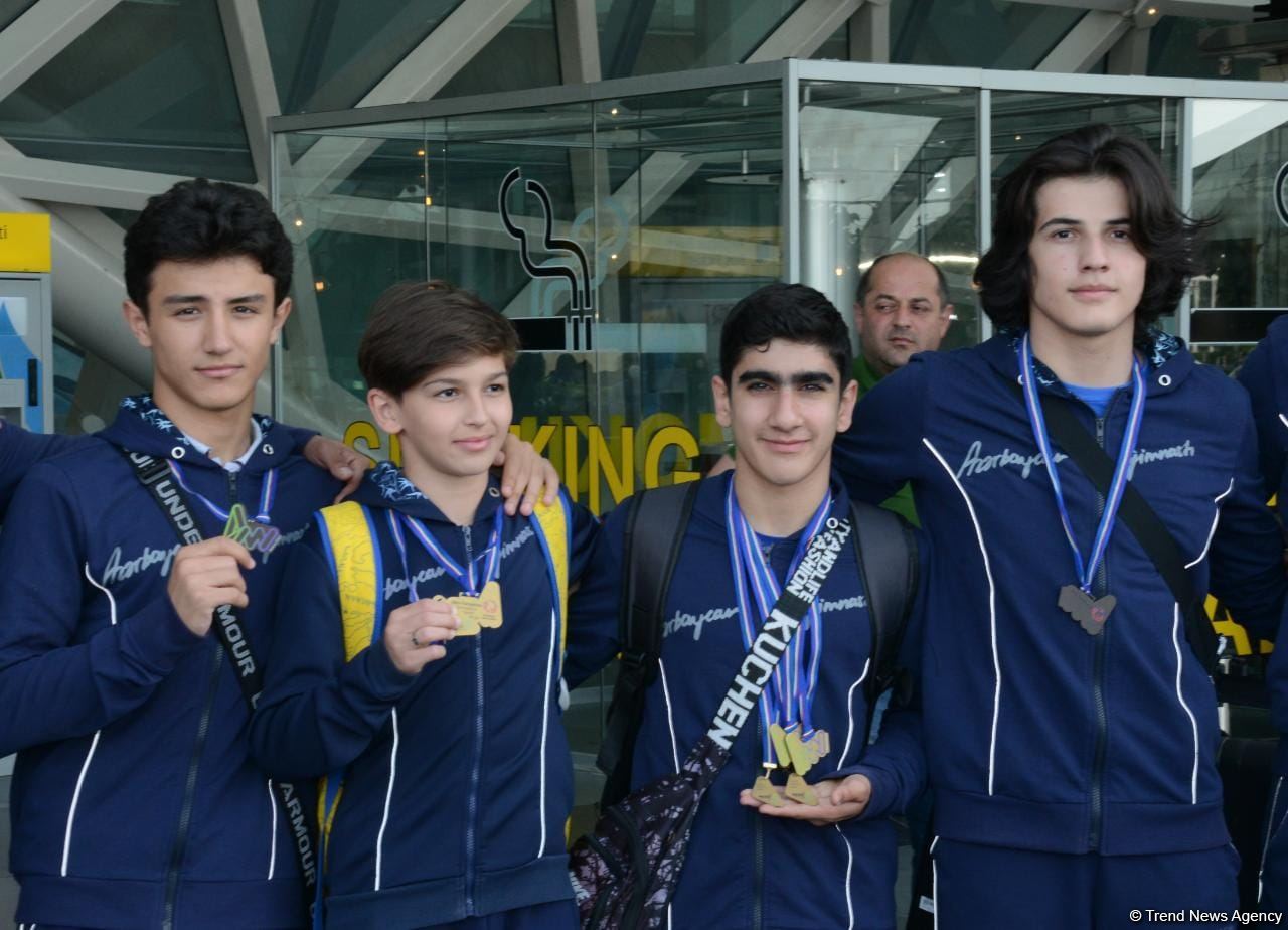 Азербайджанские гимнасты привезли в Баку из Италии медали Чемпионата Европы (ФОТО)