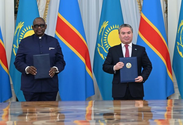 Kazakh and DR Congo presidents thumbing up joint statement