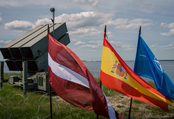 Latvian defense minister attends Spanish national day exhibition in Riga