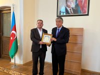 TURKSOY bestows honorary badge upon Yunus Oghuz (PHOTO)