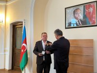 TURKSOY bestows honorary badge upon Yunus Oghuz (PHOTO)