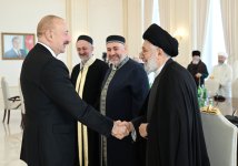 President Ilham Aliyev receives participants of international conferences held in Baku (PHOTO/VIDEO)